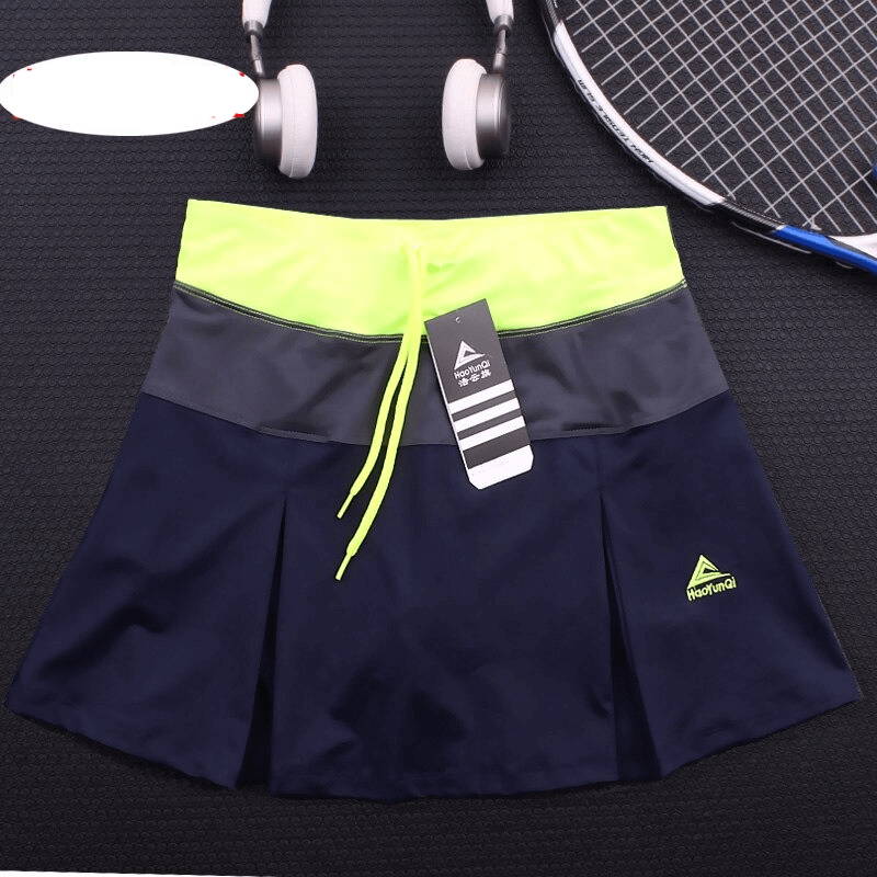 Women's breathable navy tennis skirt-shorts with lime accent, featuring pocket; perfect for sports like tennis, running, and gym.